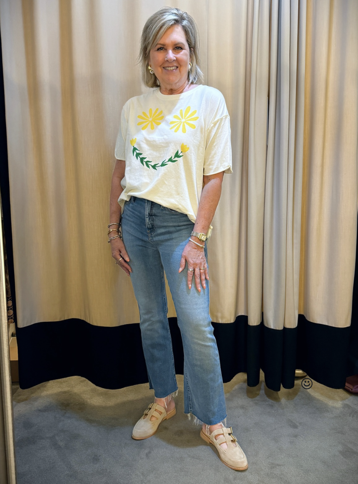 Tania wearing a Free People graphic t-shirt, jeans, and Dolce Vita Maru Jane Mules