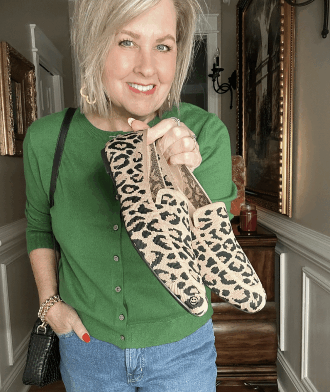 Tania in a green sweater and leopard print loafers for fall
