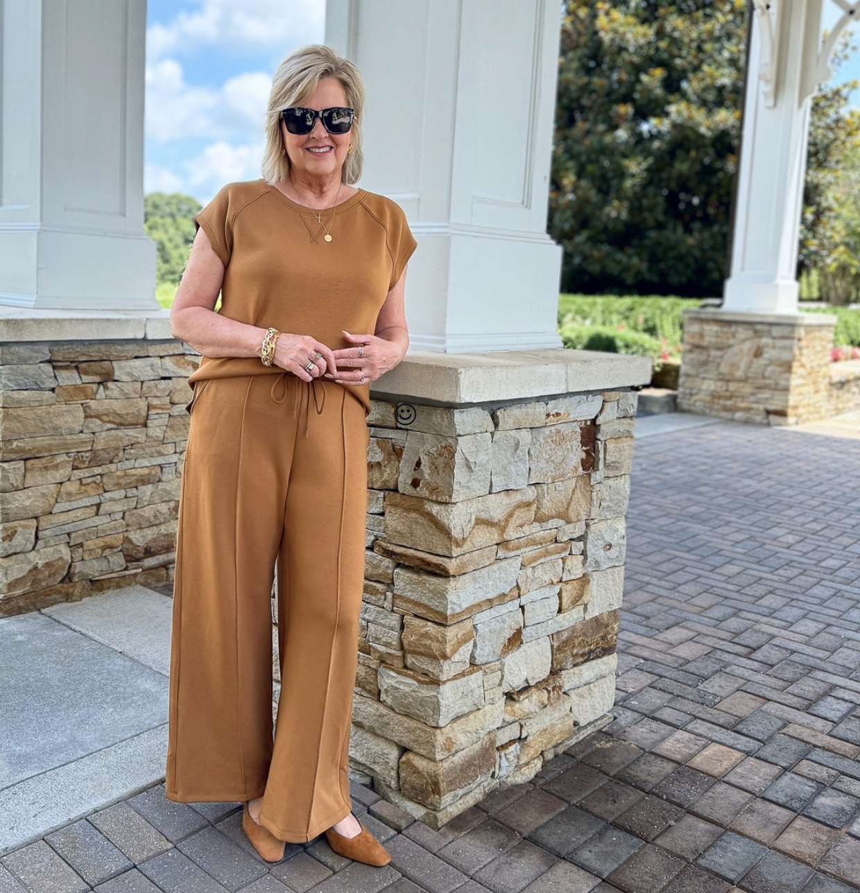 Tania Stephens wearing a monochromatic outfit of caramel brown for a slimming look