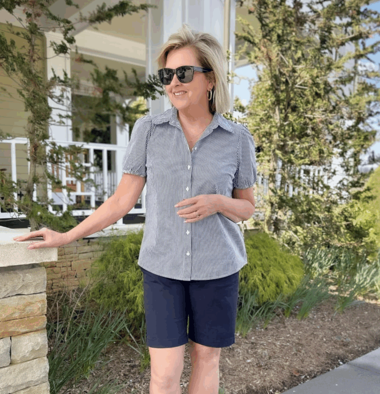 Tania wearing a striped button shirt with navy bermuda shorts for a flattering look