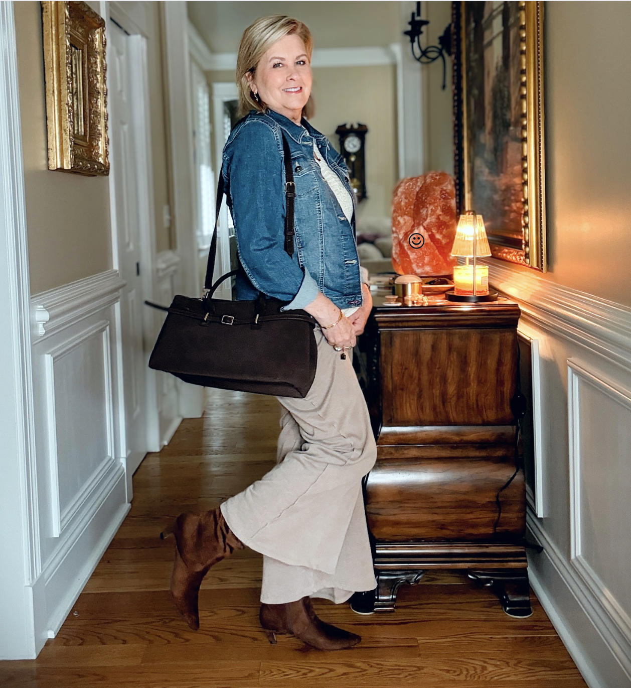 Tania is showing how to do a Summer to fall transition with jewelry, a denim jacket, boots, and a chocolate brown faux suede bag