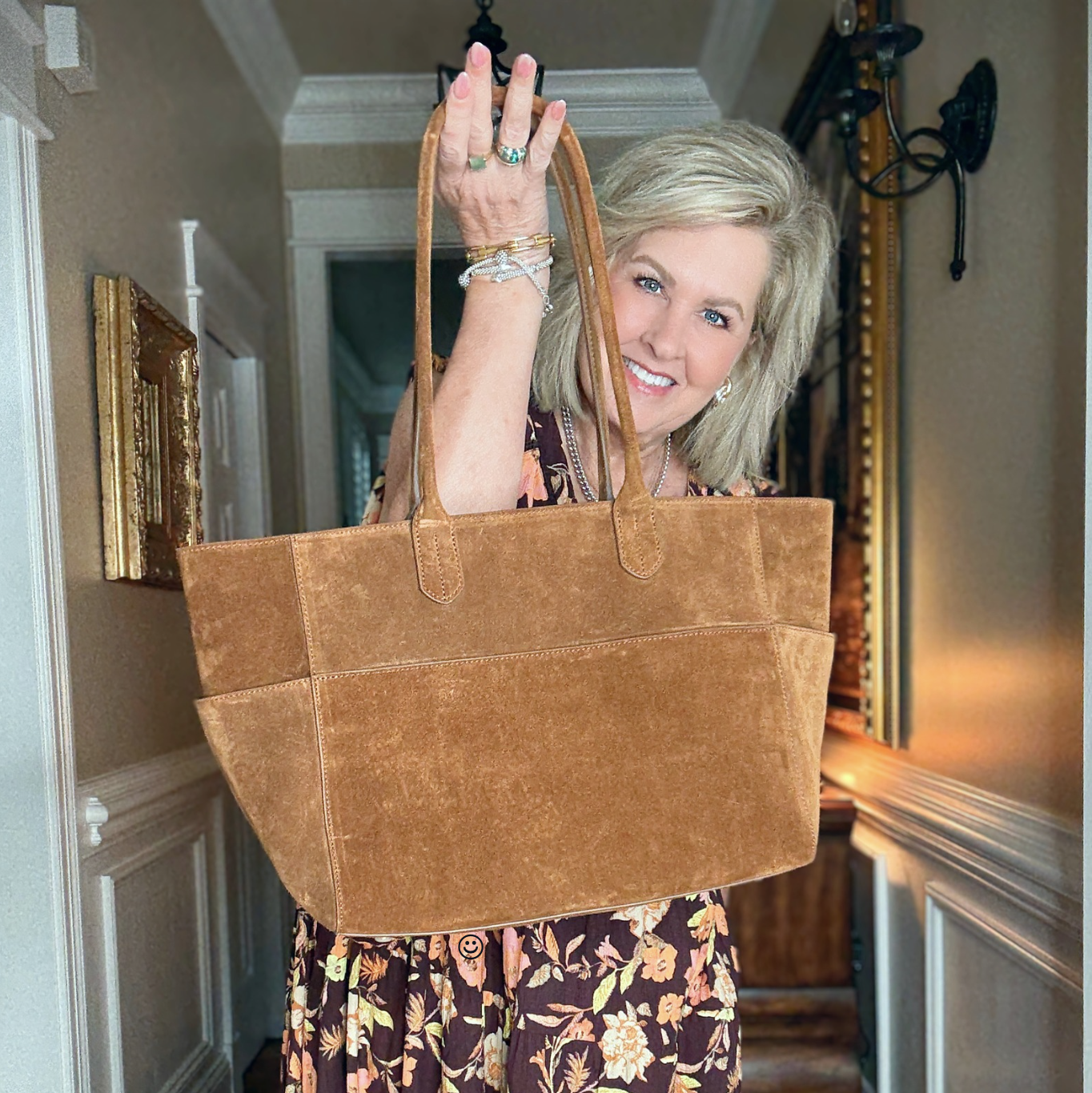 Tania showing a large suede shopper tote from Quince.