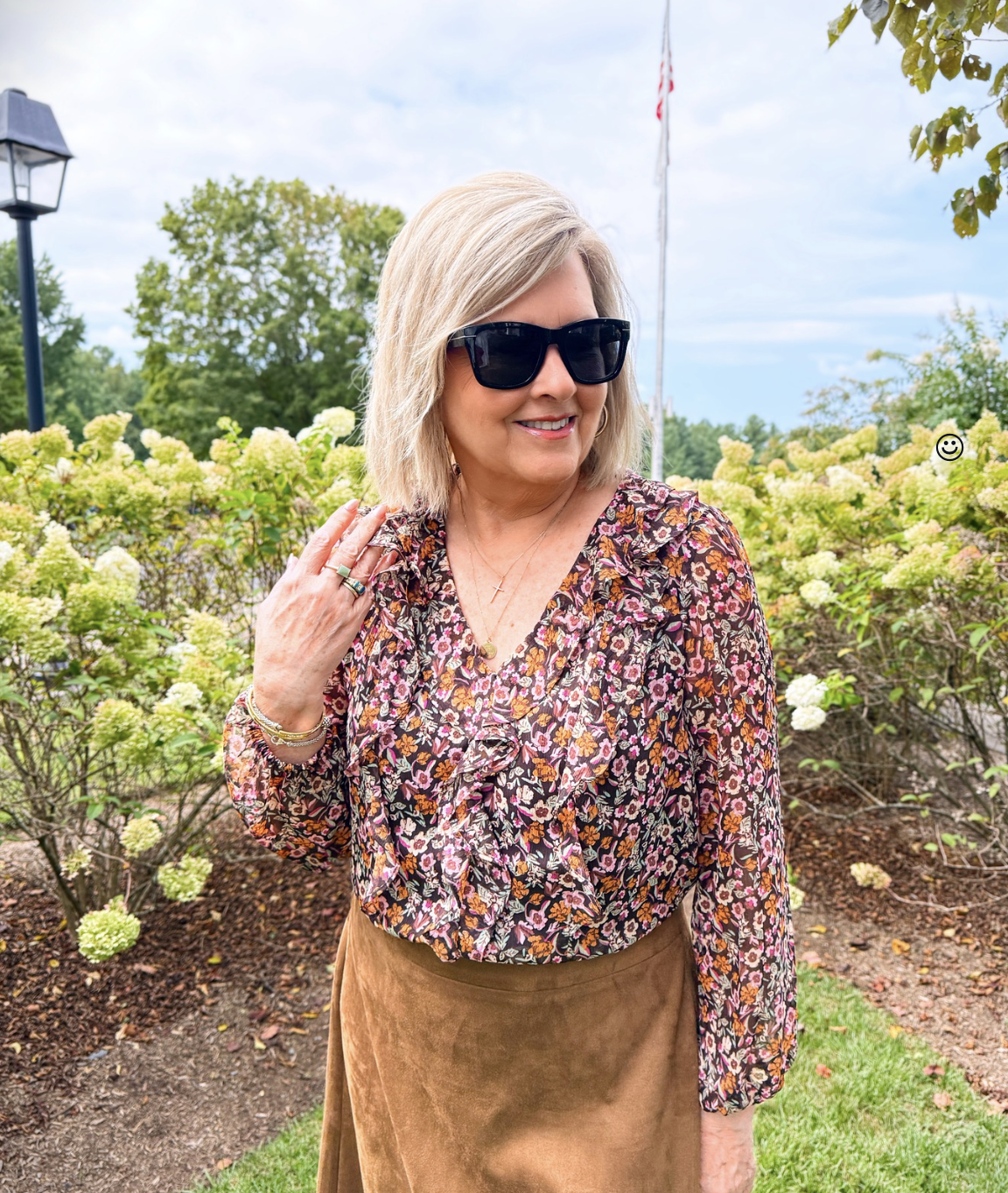 Tania Stephens wearing a printed ruffled top from Kohl's