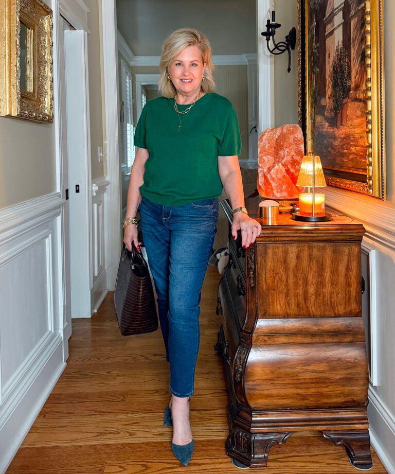 Tania Stephens wearing a Fall short sleeve swearer from Quince and jeans from Walmart
