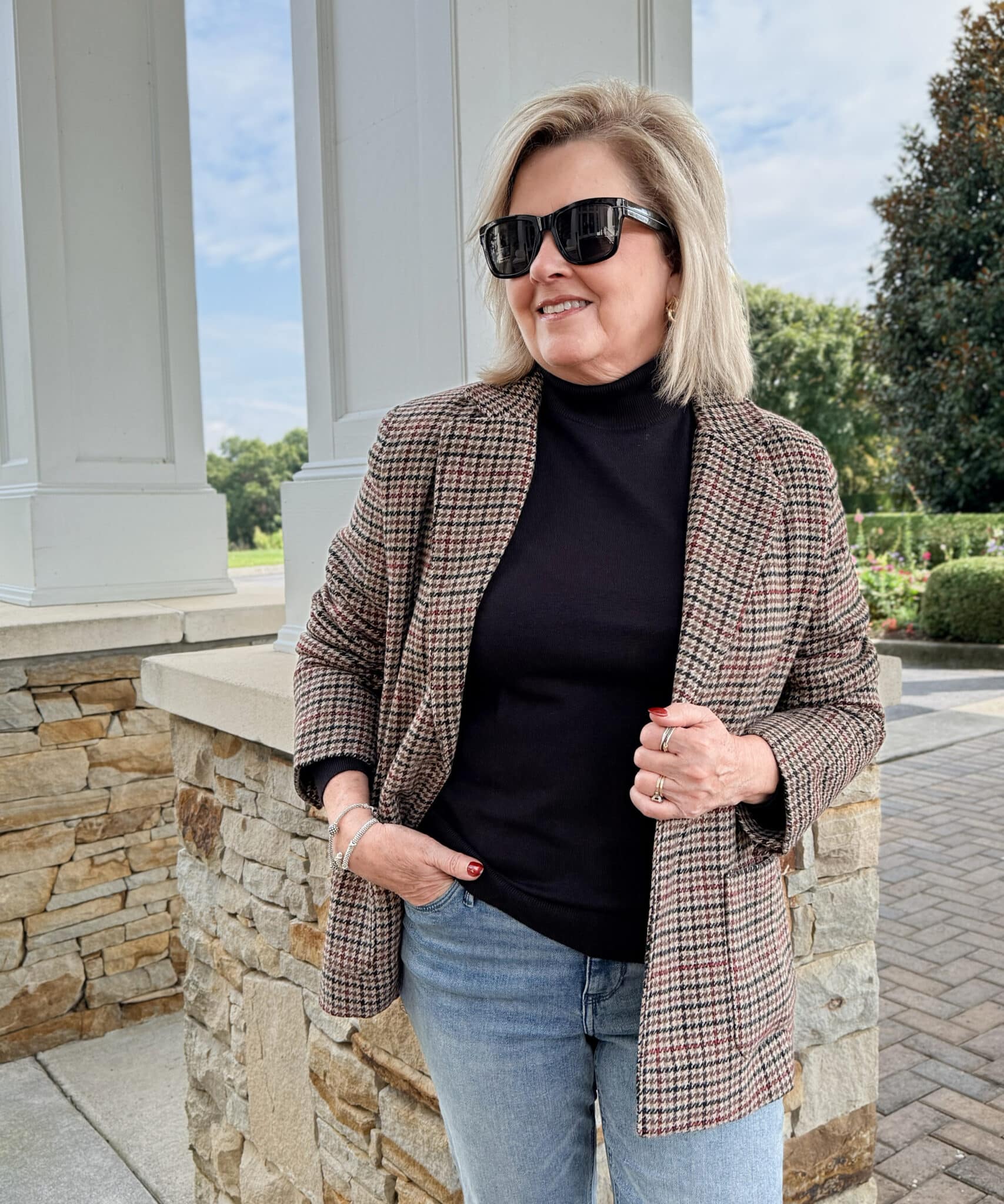 Tania wearing a plaid blazer with a black turtleneck from Kohl's