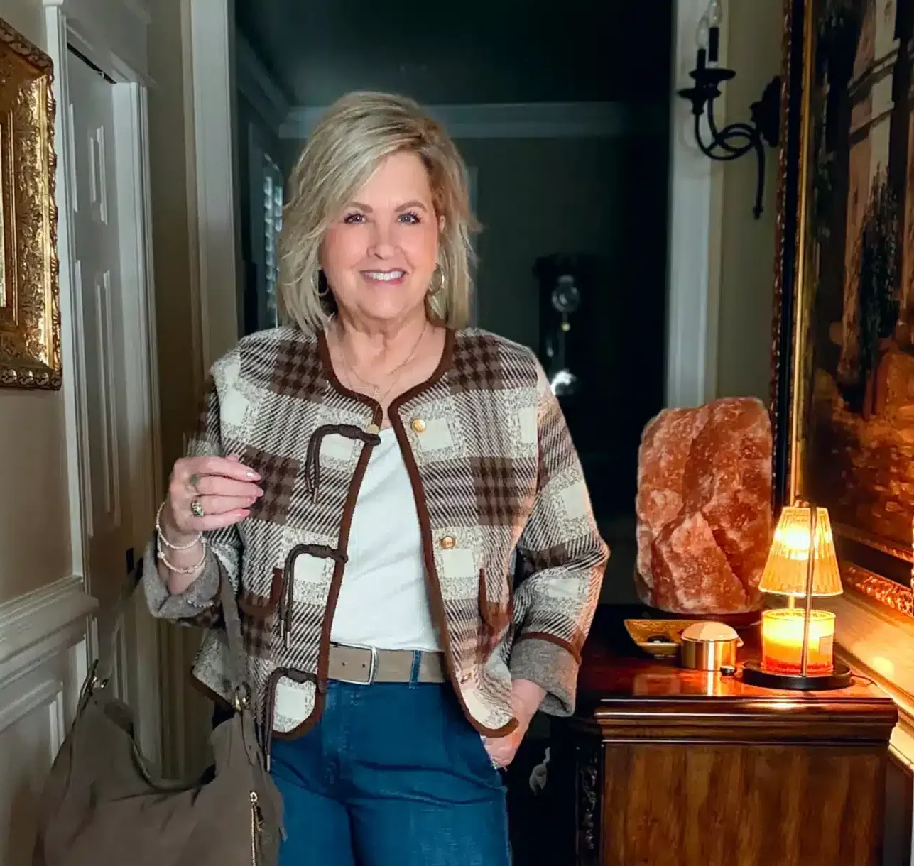 Tania wearing a plaid jacket and a statement suede belt