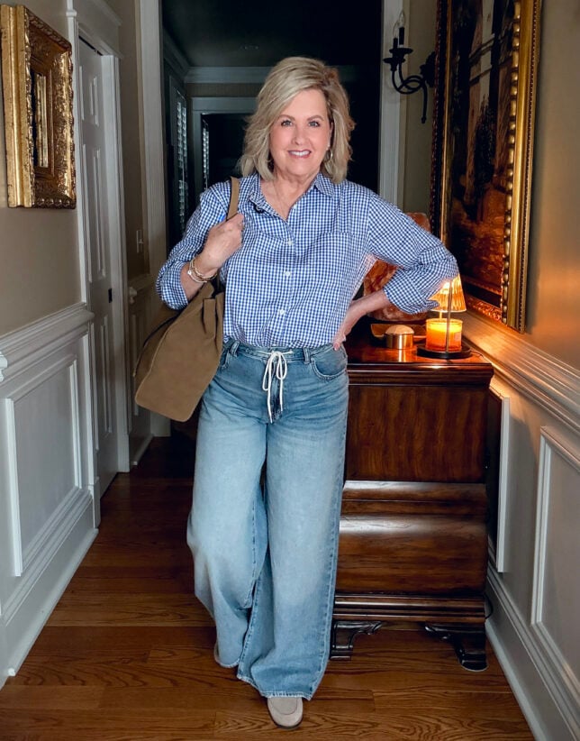 Tania wearung a gingham check shirt with drawstring jeans