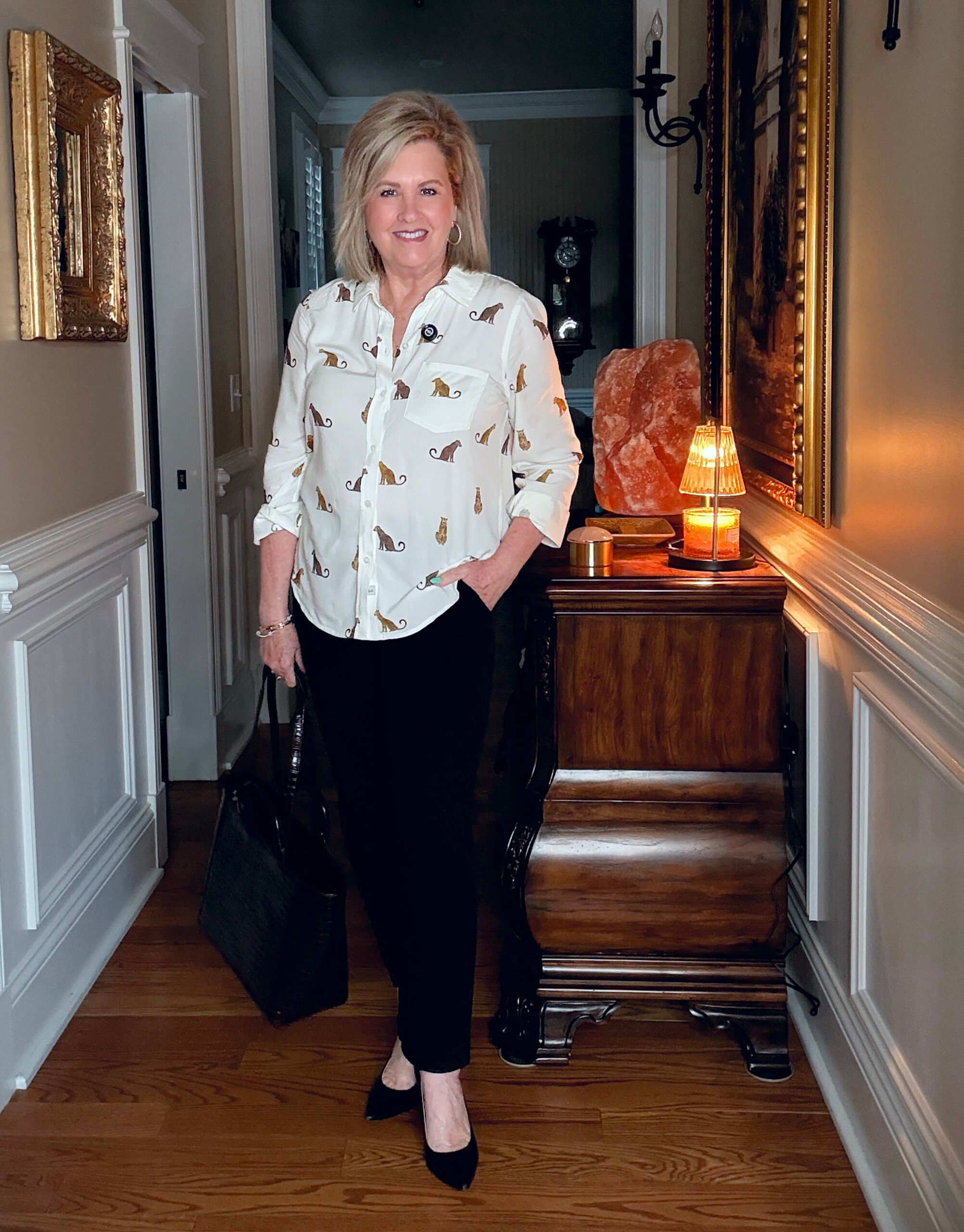 Tania wearing a cheetah button up shirt with black pants from Ann Taylor
