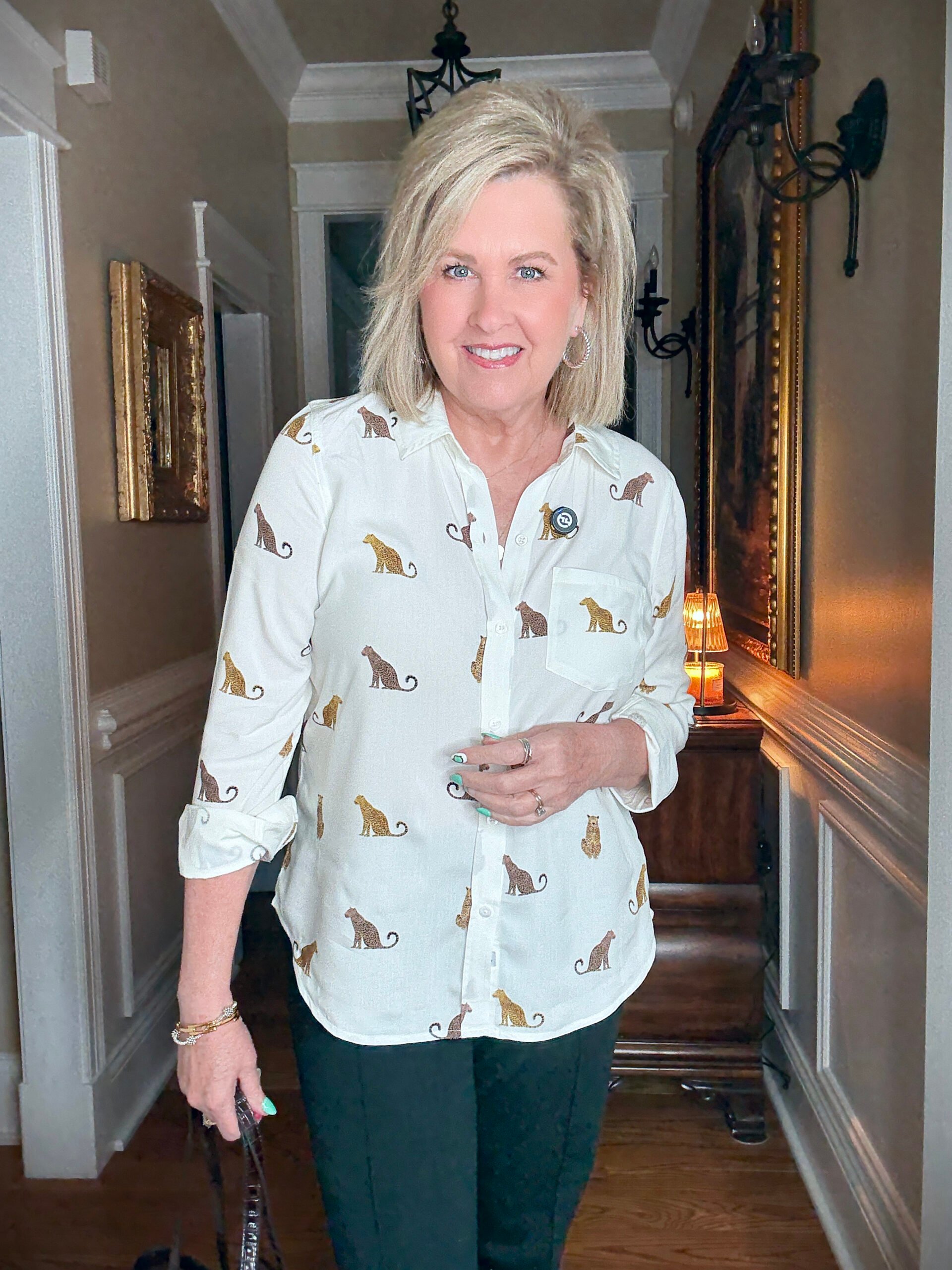 Tania wearing a cheetah button up shirt 