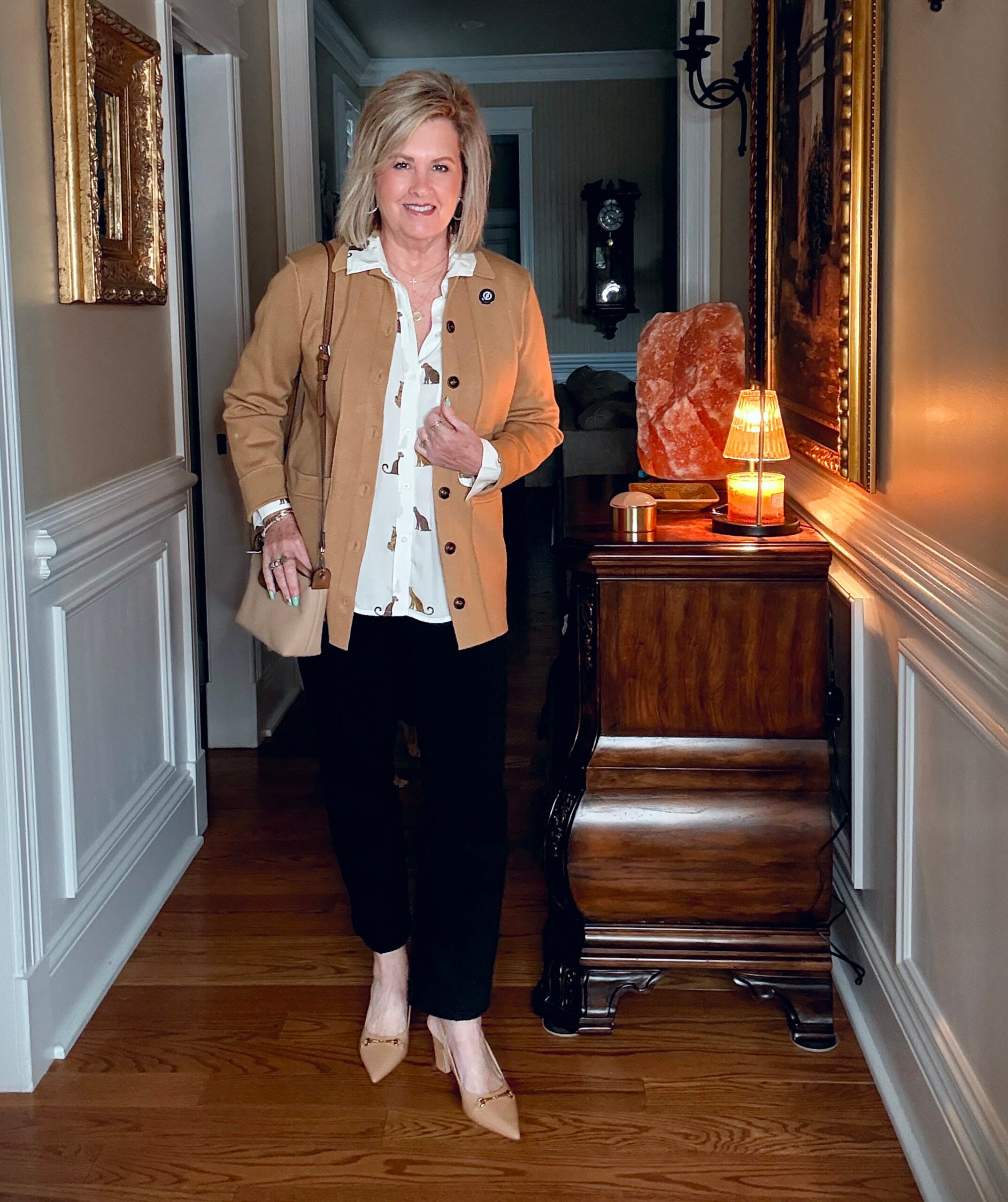 Tania wearing a cheetah button up shirt with a knit blazer, and black pants from Ann Taylor