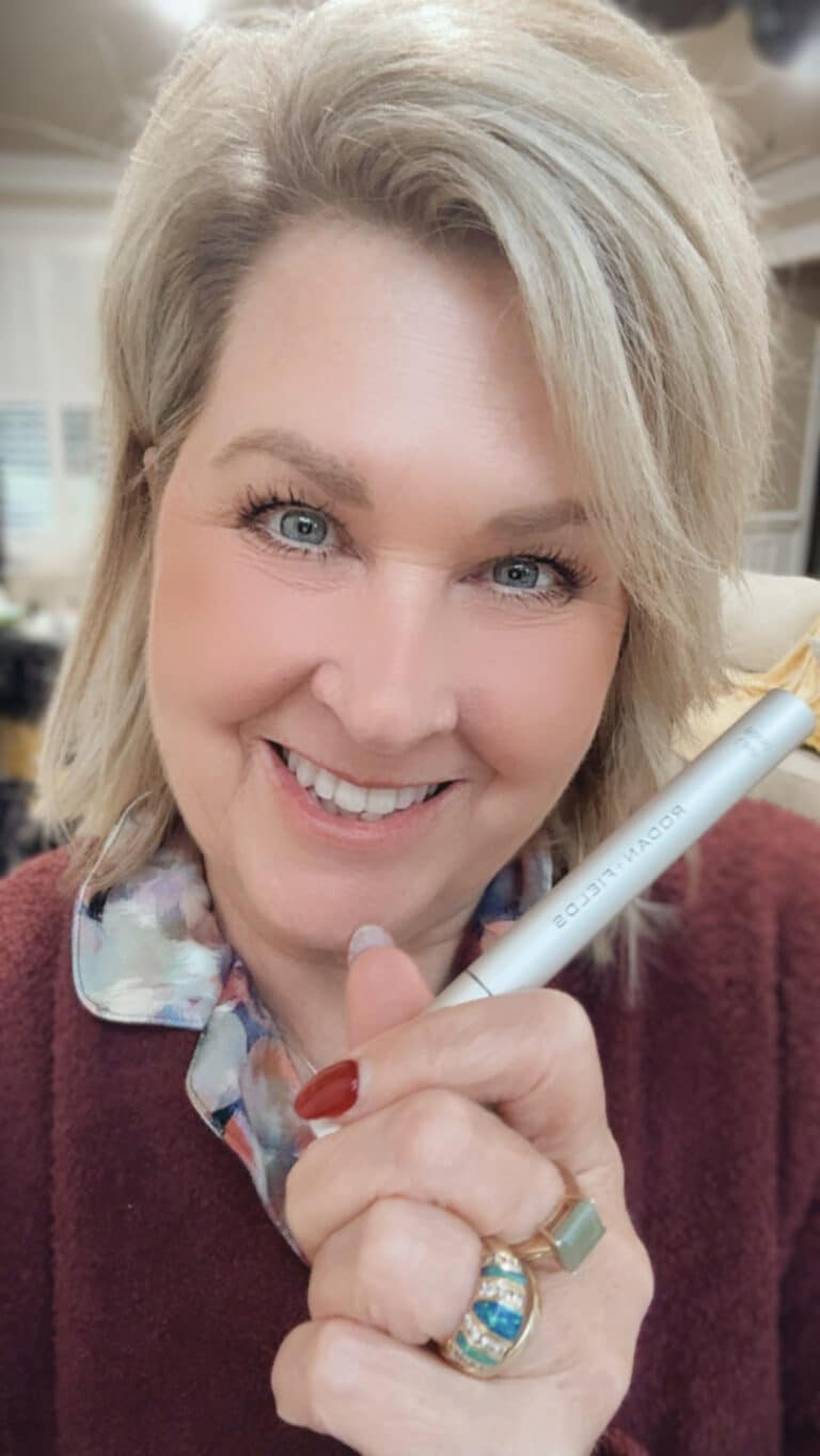 Tania Stephens holding Lash Boost by Rodan + Fields