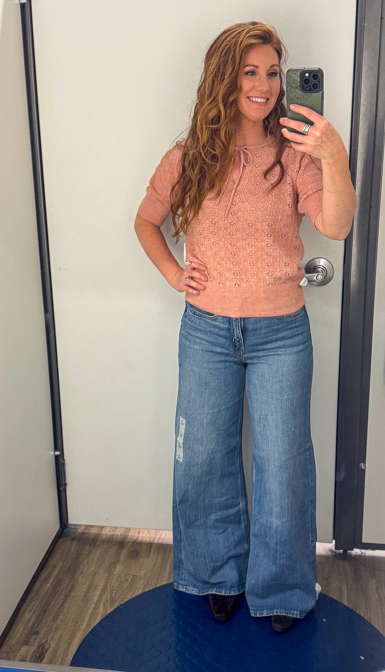 Stephanie wearing a light rust sweater and wide leg jeans for fall from Old Navy