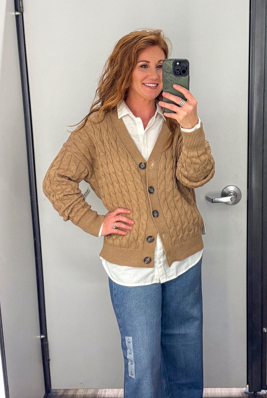 Stephanie wearing a cable knit sweater with a white boyfriend shirt and wide leg jeans for fall from Old Navy