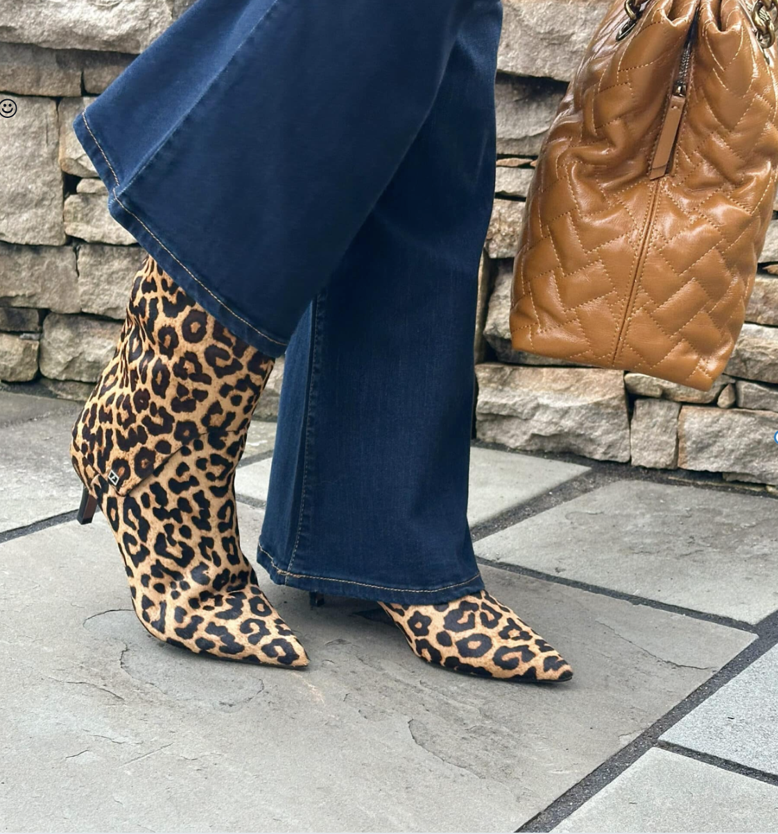 Tania Stephens wearing a pair of jeans and animal print boots