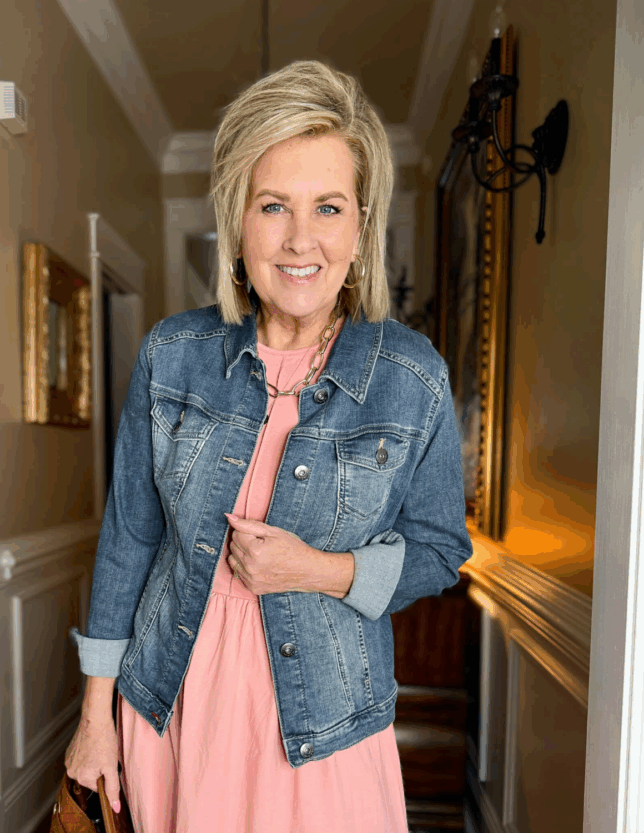 Tania wearing a pink dress and a denim jacket from Amazon