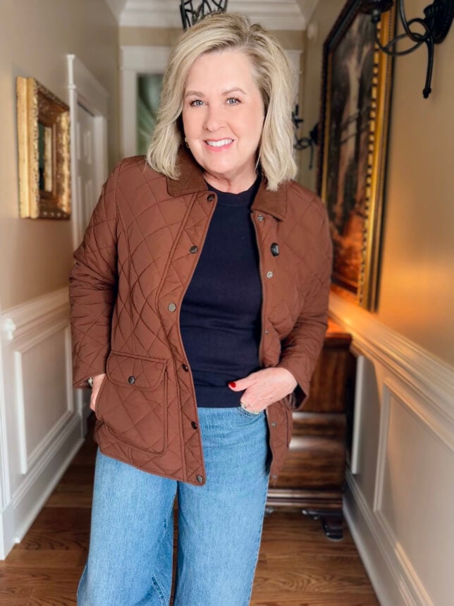 Tania wearing a Walmart Brown quilted coat and navy tee