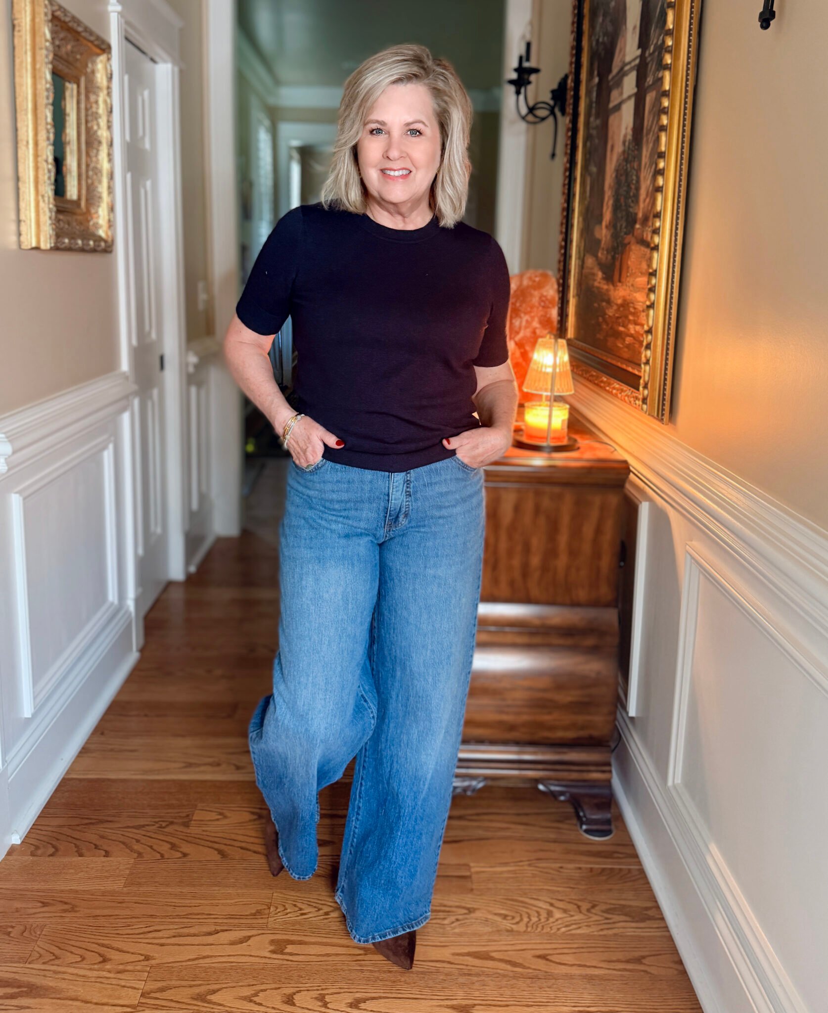 Tania wearing a Walmart navy Free Assembly sweater and wide leg jeans