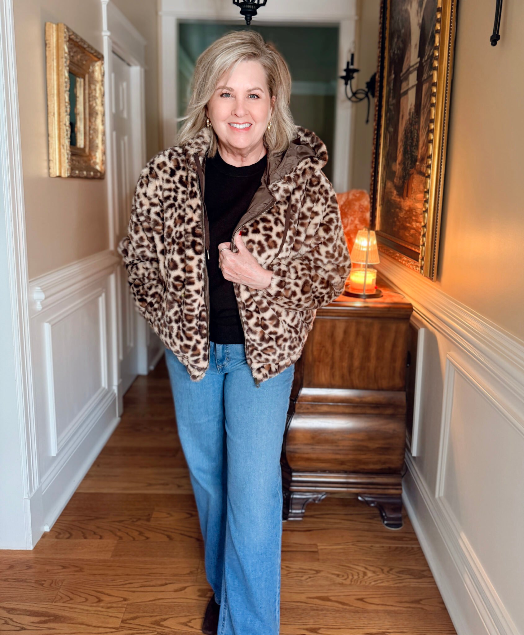 Tania wearing a Walmart plush jacket and jeans