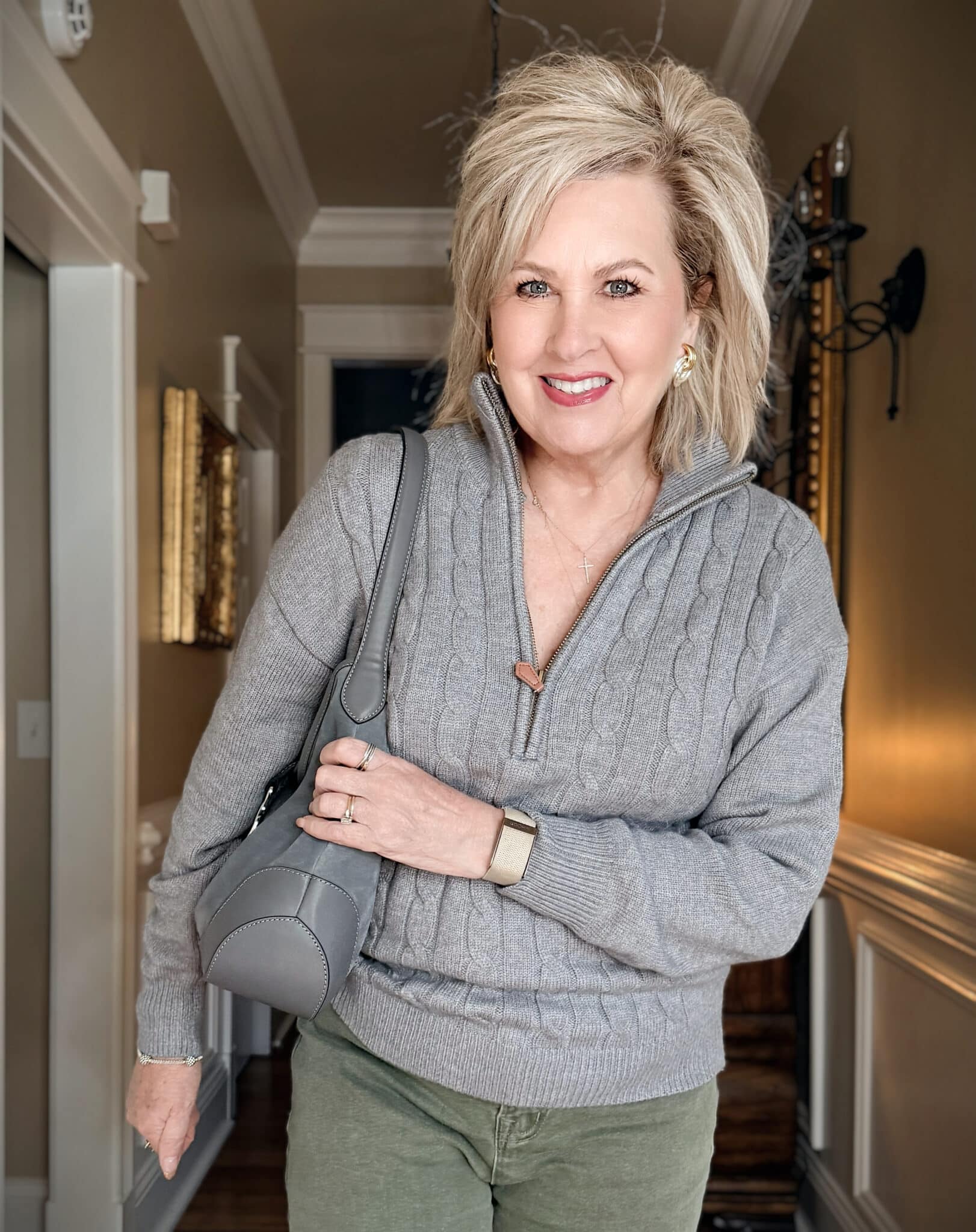 Tania in an Amazon 1/4 zip gray sweater