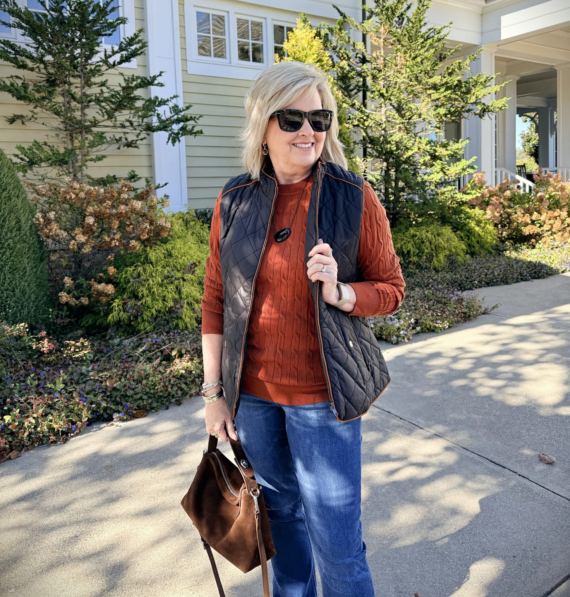 Tania wearing an Amazon rust sweater with a black quilted vest
