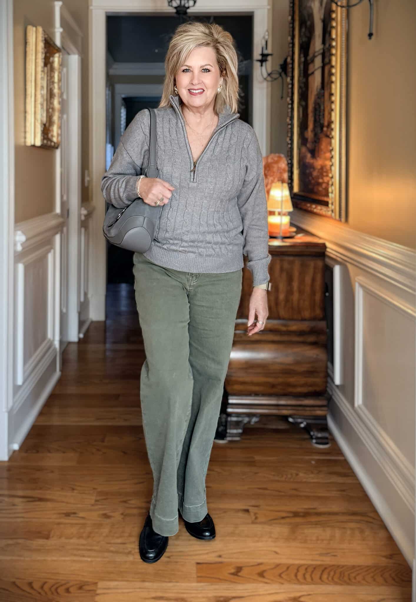 Tania wearing an Amazon wide leg jeans with a gray cable knit sweater