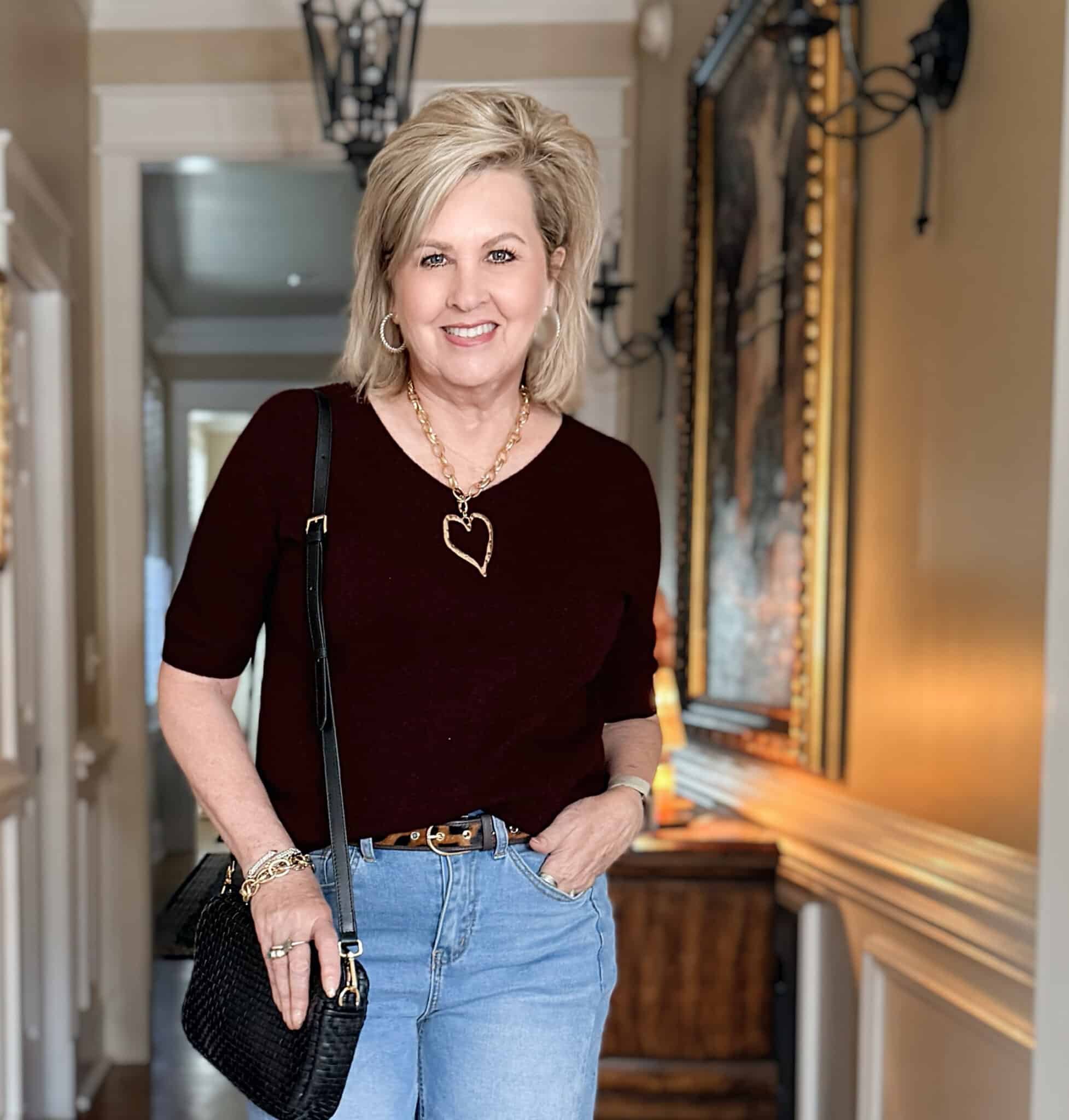 Tania is an Amazon wine sweater with gold heart