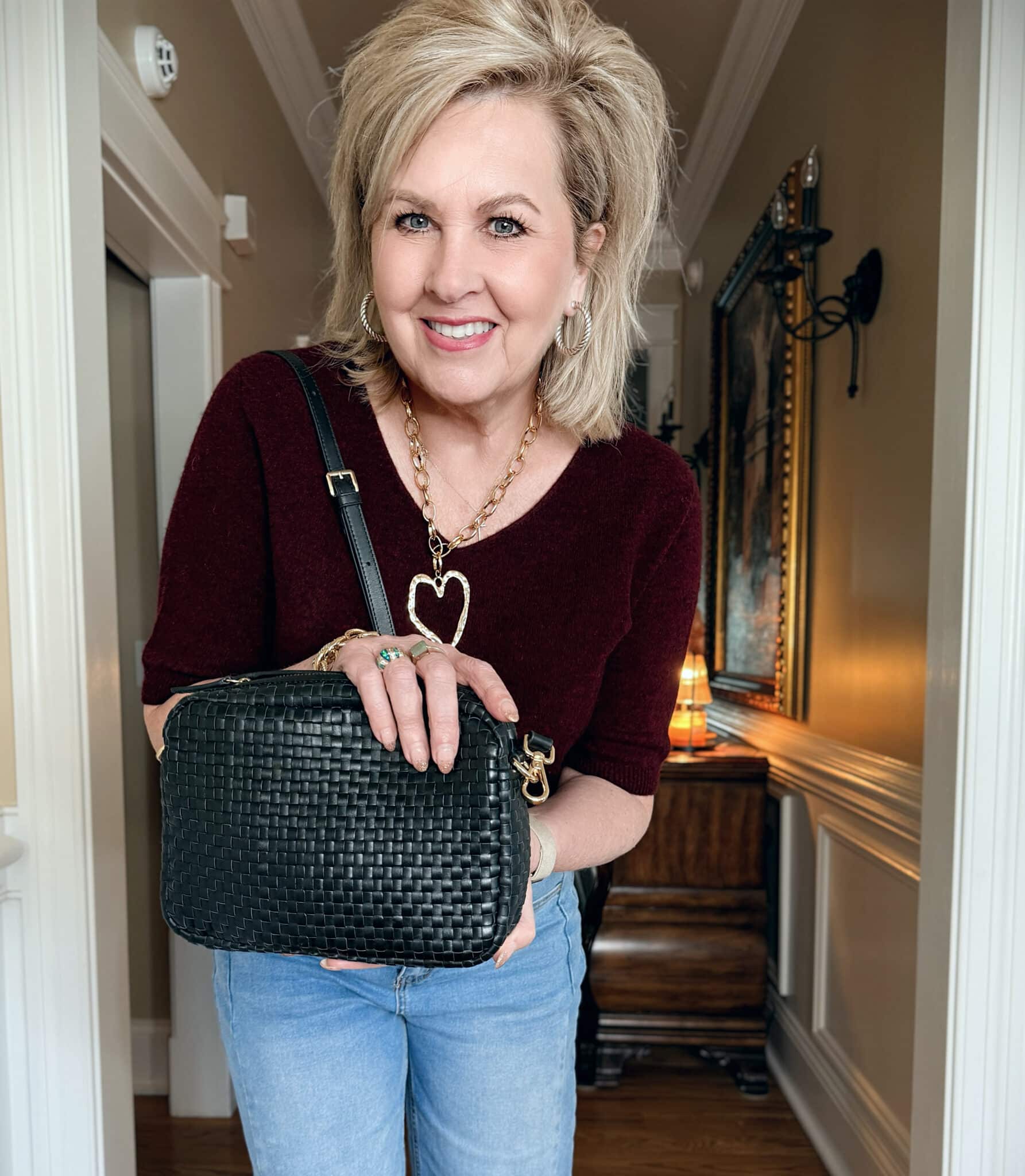 Amazon wine v-neck sweater and Quince woven handbag