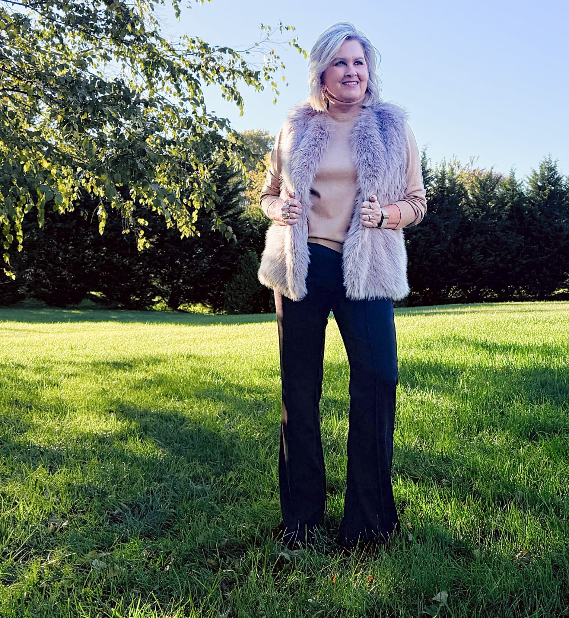 Tania Stephens wearing a  Kohl's Faux fur vest with brown pintucked pants