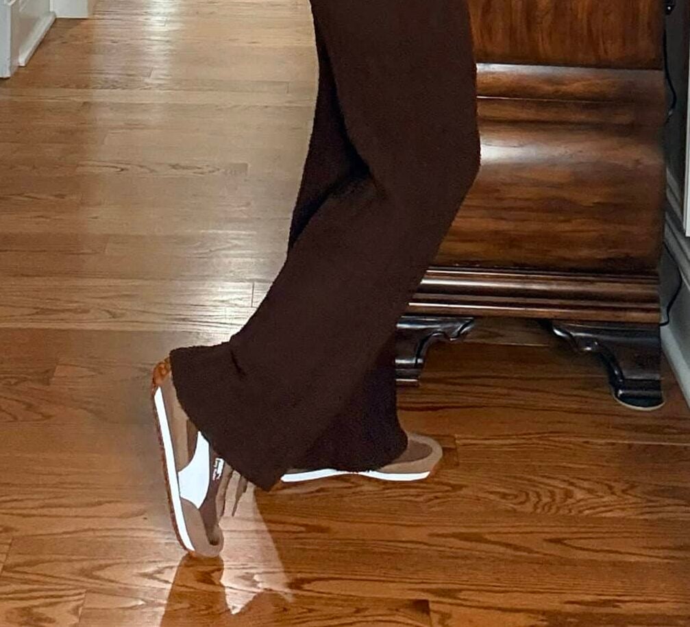 Tania wearing dark brown fuzzy pants with brown sneakers 