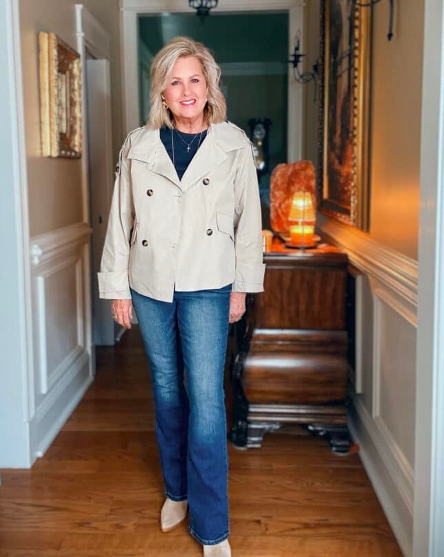 Tania wearing a navy tee and jeans with a light wight cropped trench jacket from Amazon
