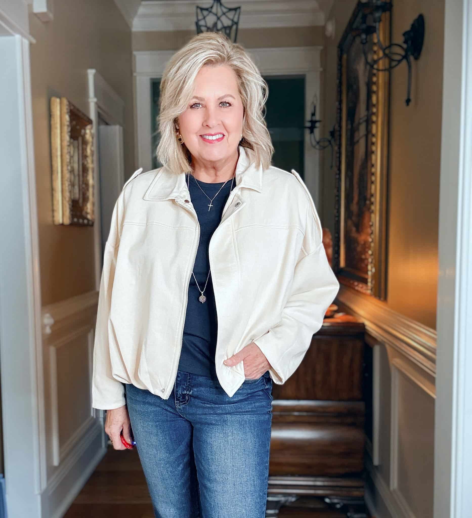 Tania wearing a navy tee with a light colored cropped cloud jacket from Amazon
