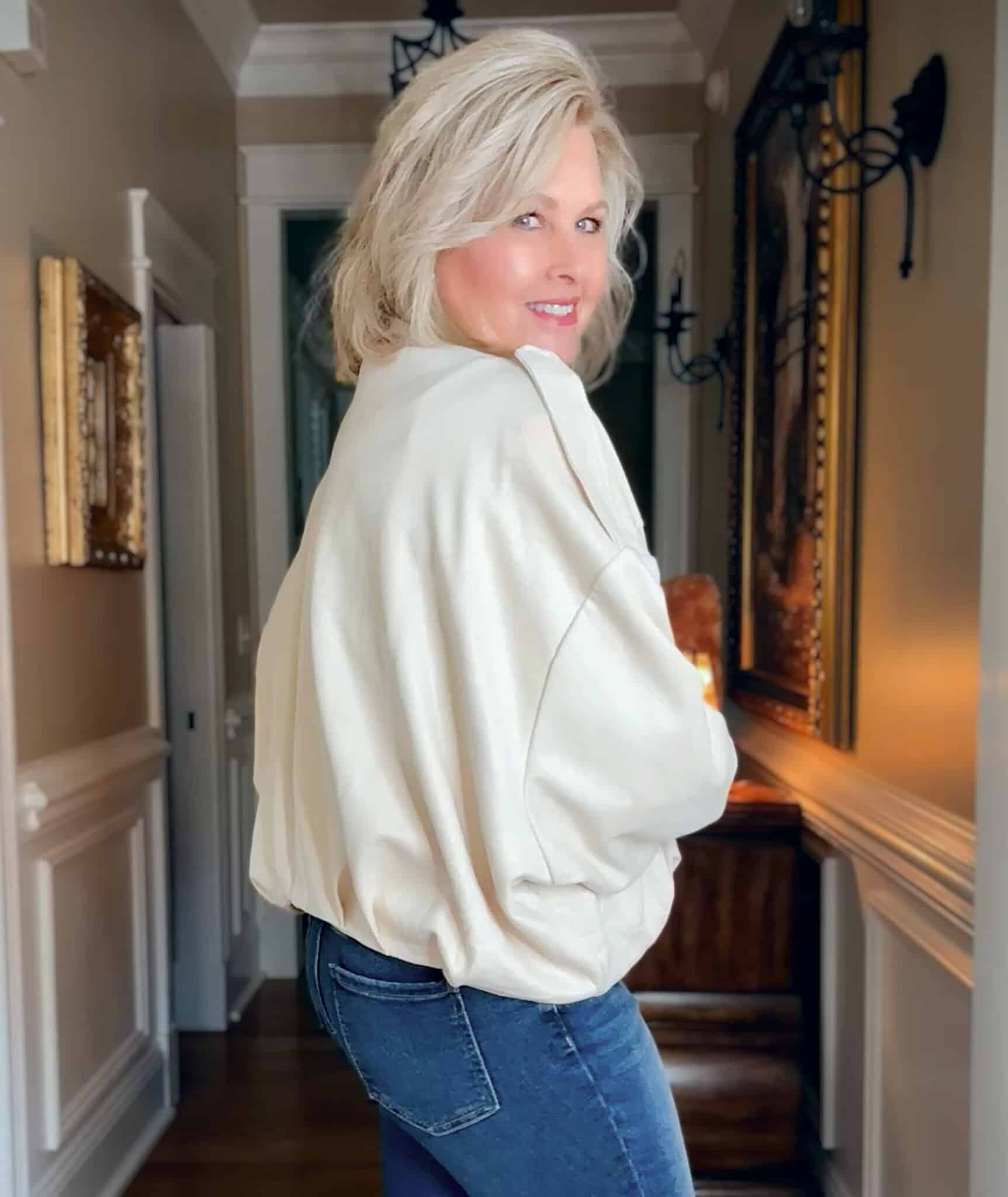 Tania wearing a light colored cropped cloud jacket from Amazon