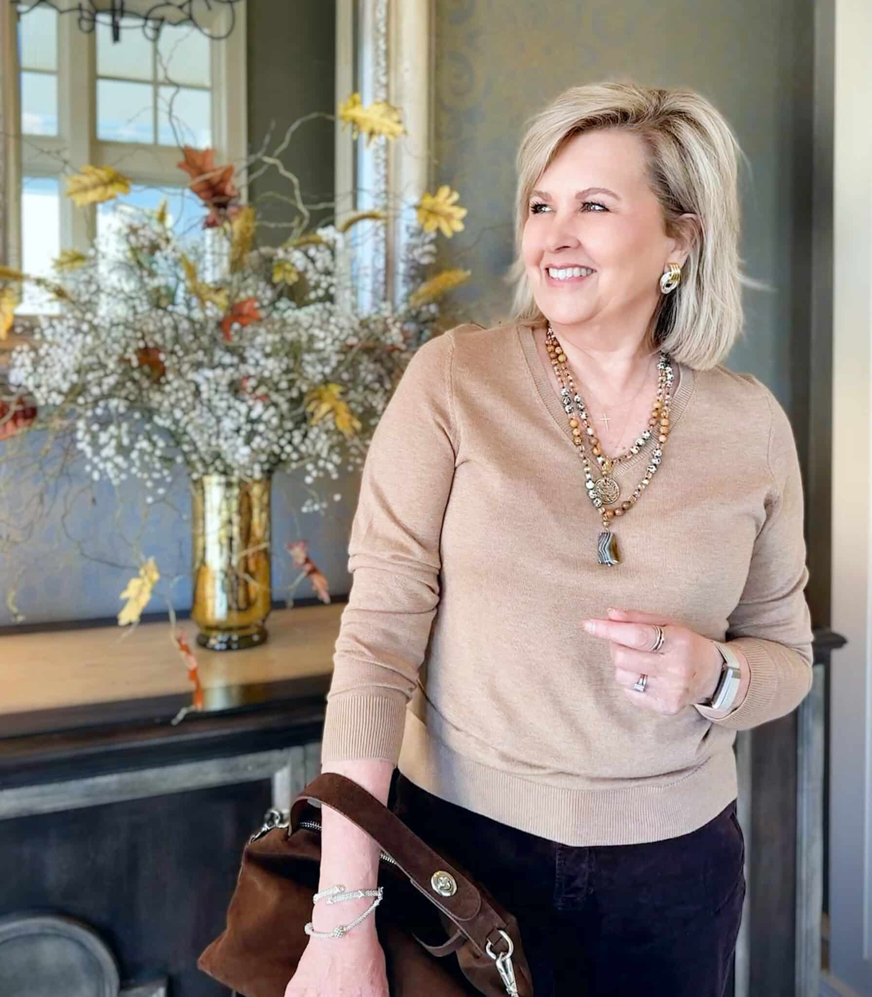 Tania wearing a camel sweater from Amazon