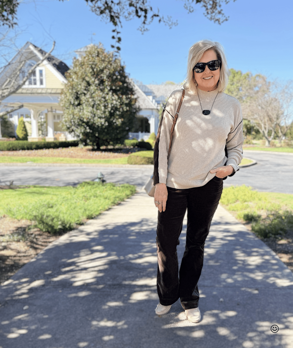 Tania wearing a color block sweater with corduroy pants from J.Jill