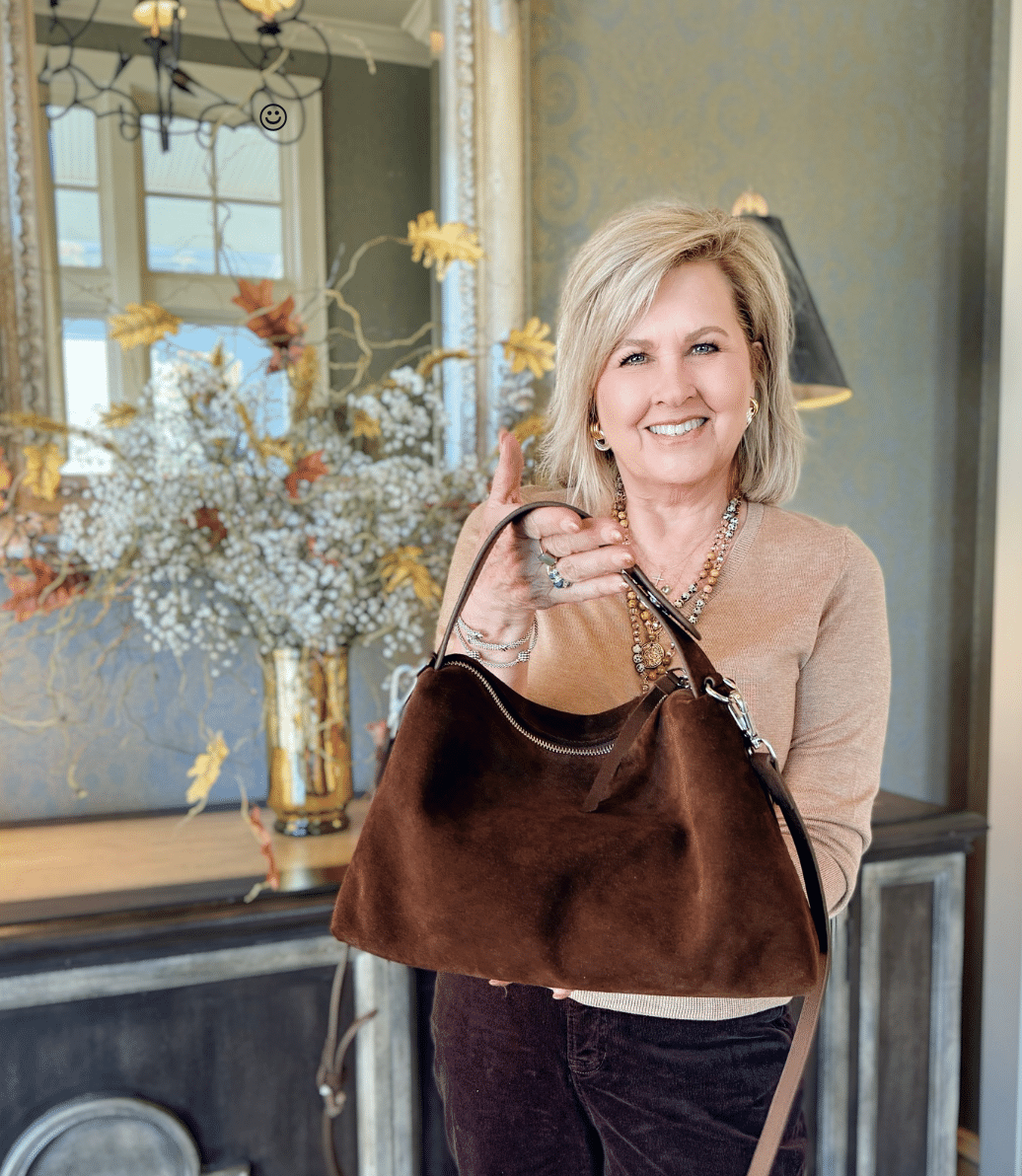 Tania wearing a camel sweater from Amazon and a chocolate brown handbag