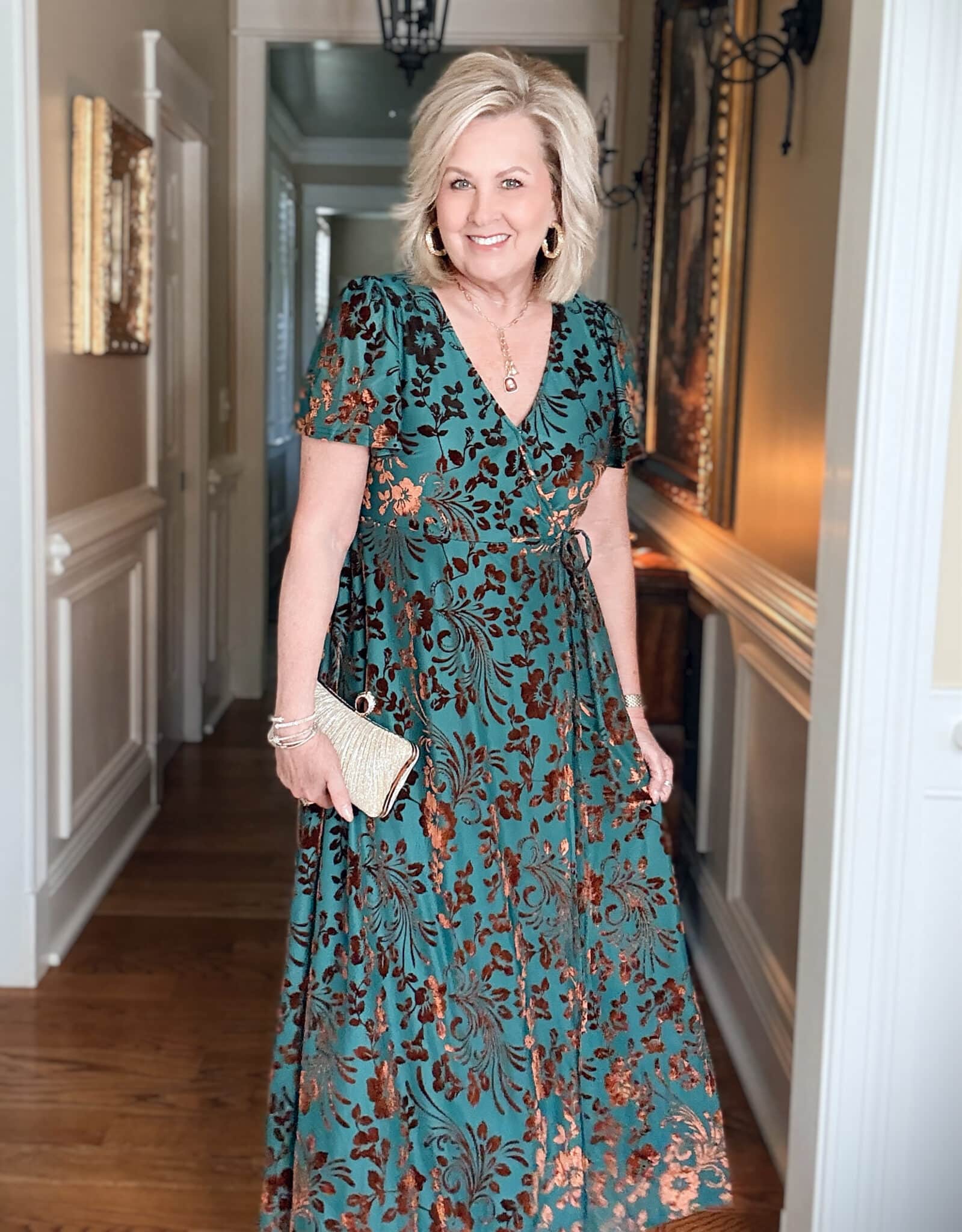 Tania wearing a teal and rust wrap dress from Amazon