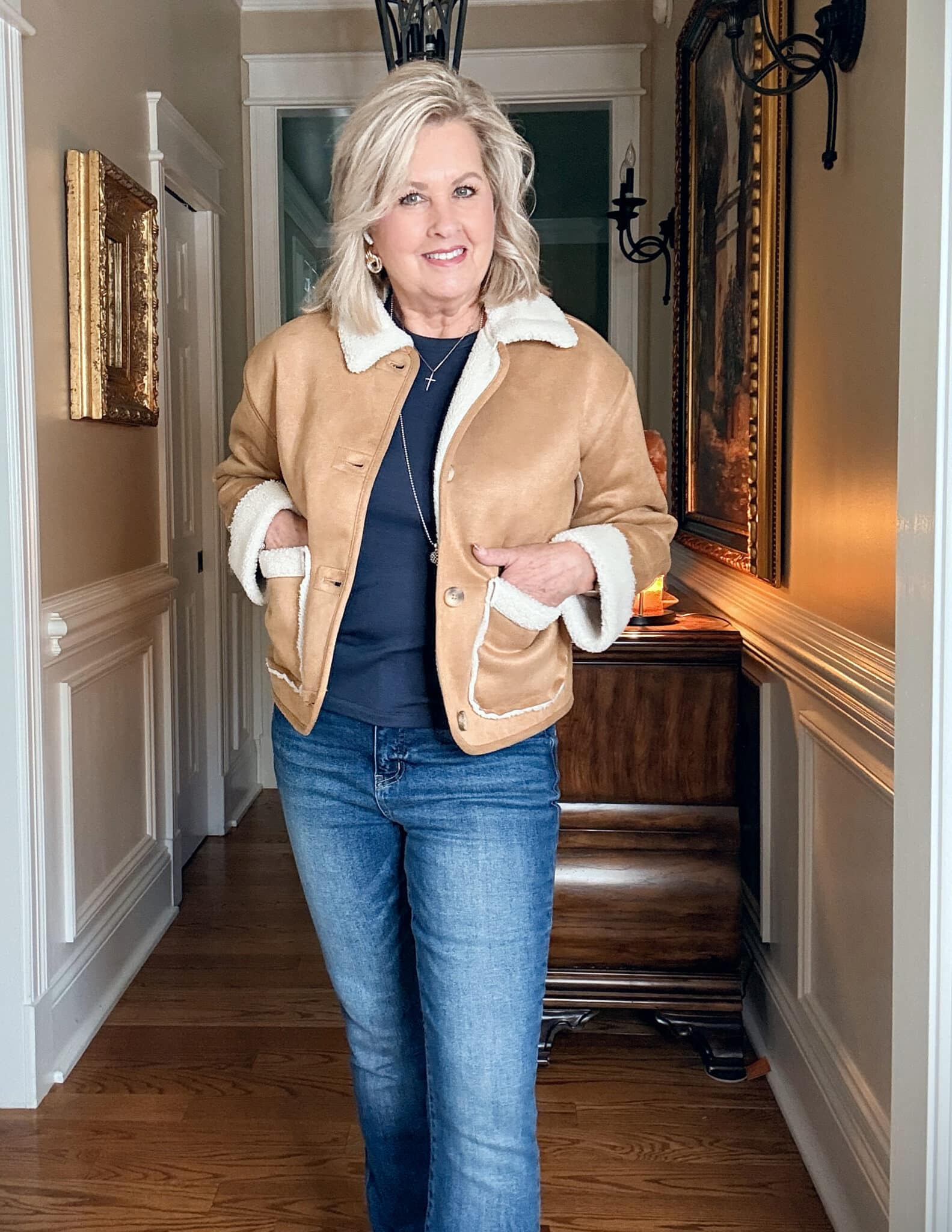 Walmart Faux suede and shearling jacket with jeans and a navy tee