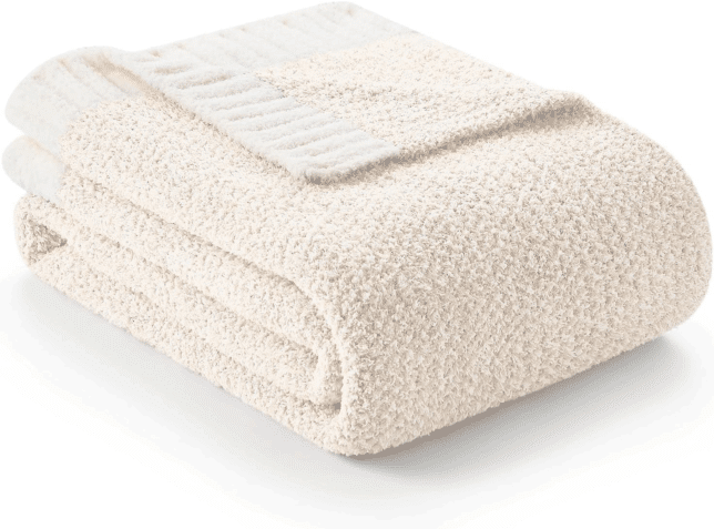 Ivory knit throw blanket soft and cozy for fall and winter lounging.