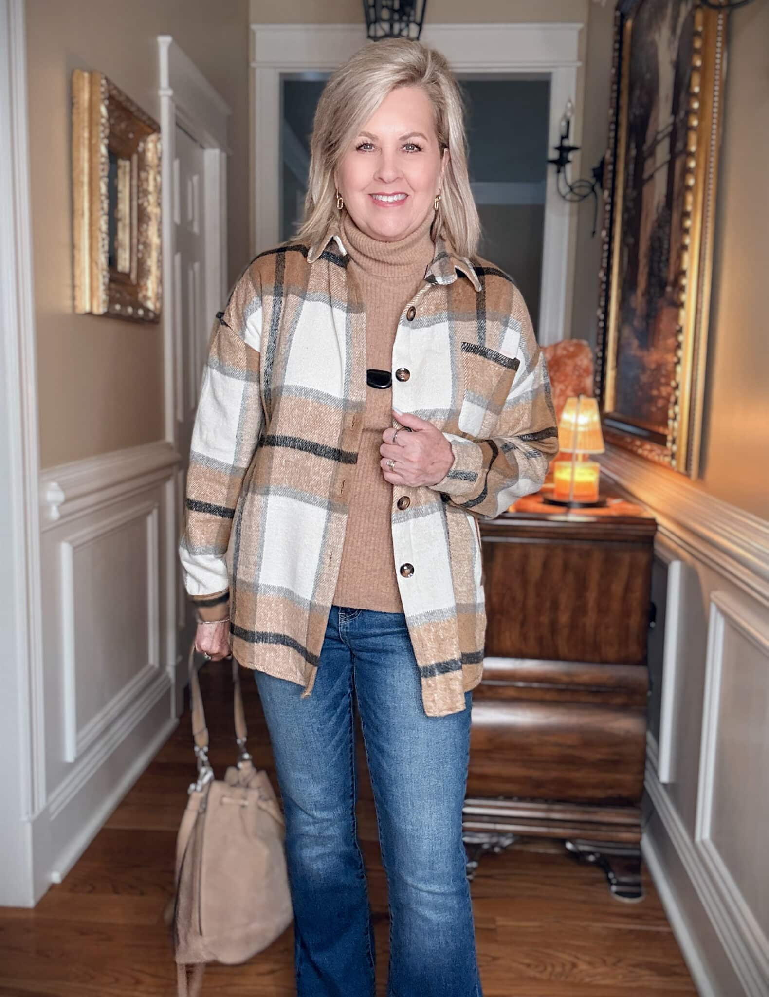 Tania wearing a plaid shacket with a camel cashmere sweater