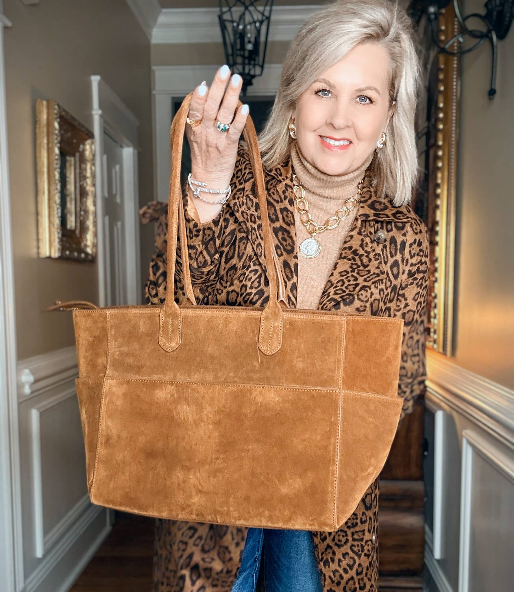 Tania wearing a leopard print coat from Amazon with a Whiskey colored tote