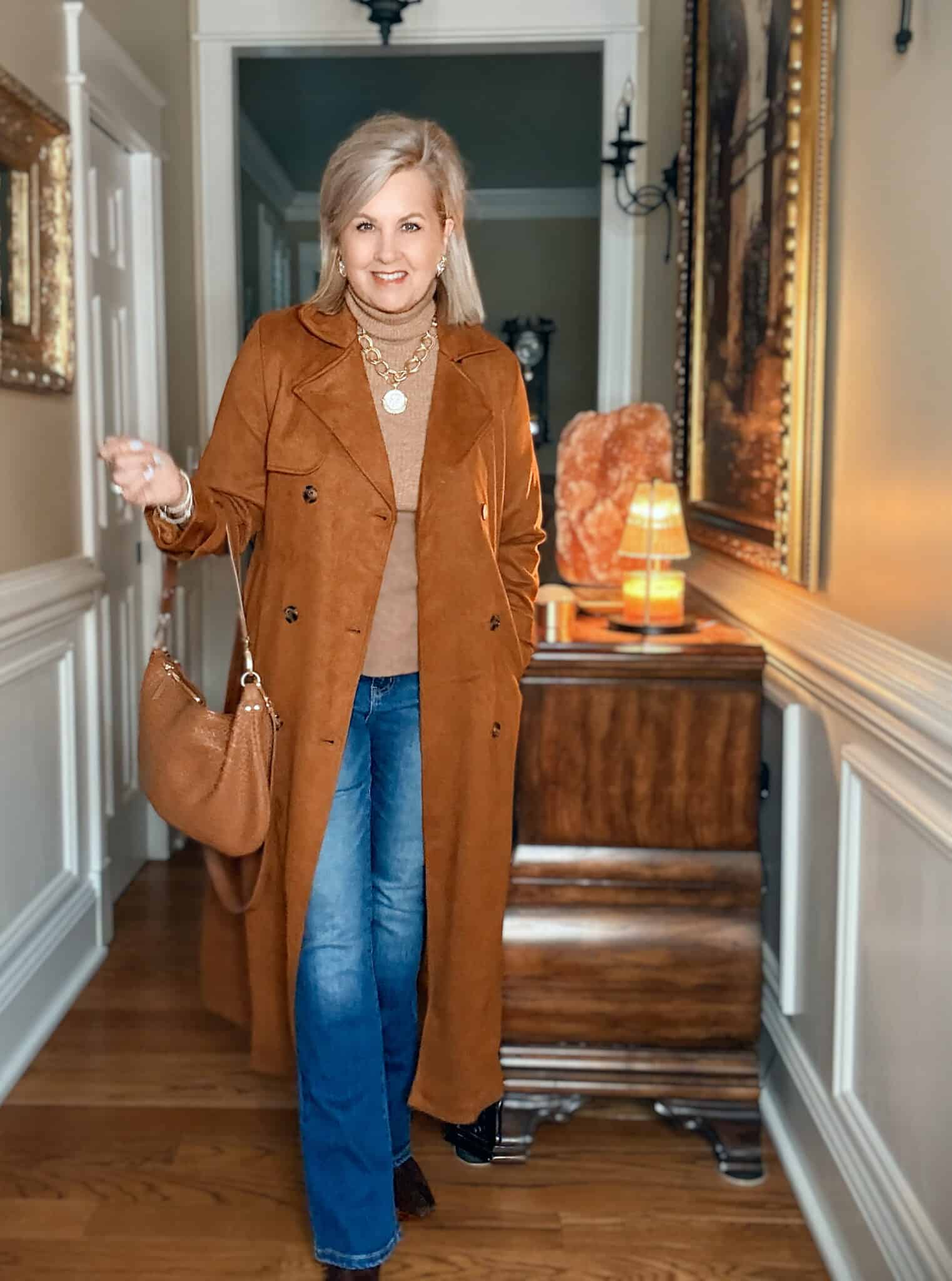 Tania wearing a dark caramel faux suede trench coat from Amazon