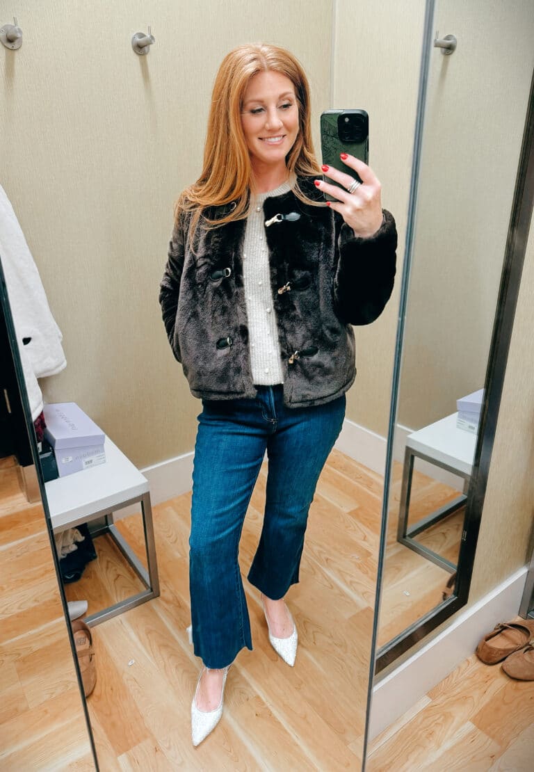 Stephanie wearing a ivory sweater with a faux fur jacket and cropped jeans from Kohl's