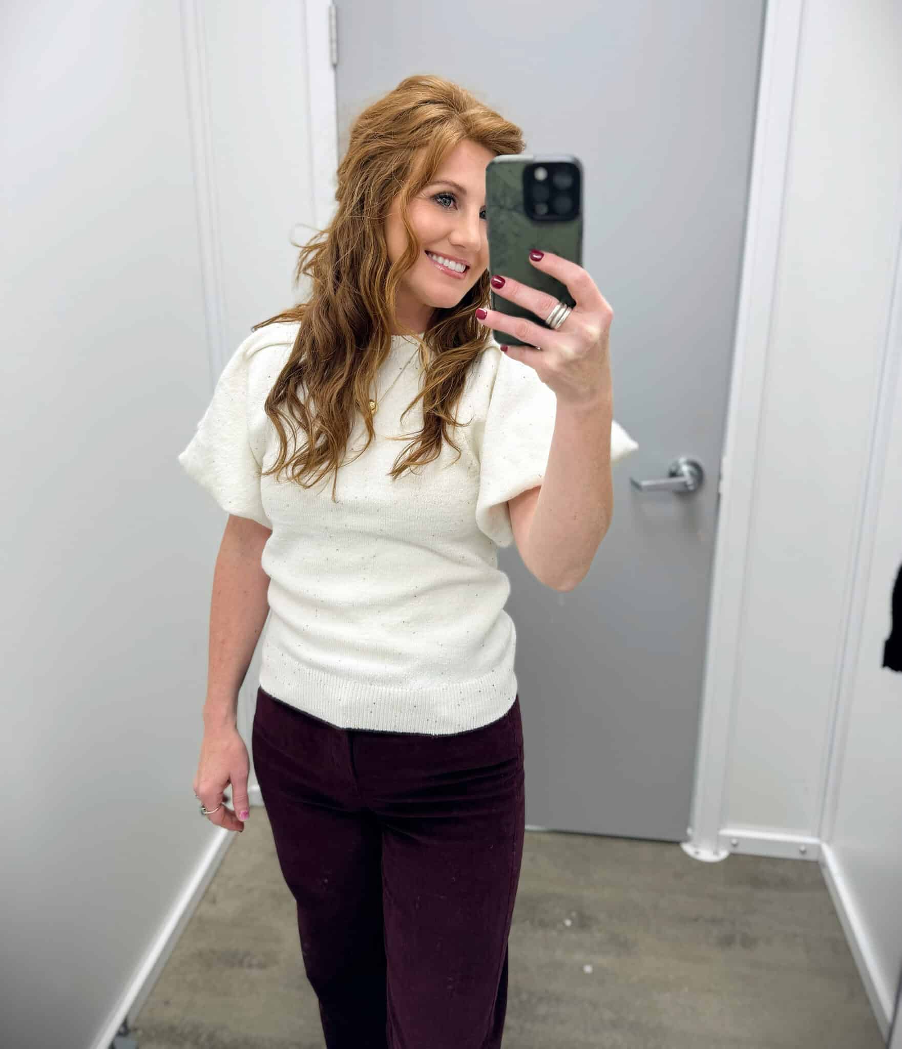 Stephanie wearing velvet pants and a ivory puff sleeve sweater from Walmart