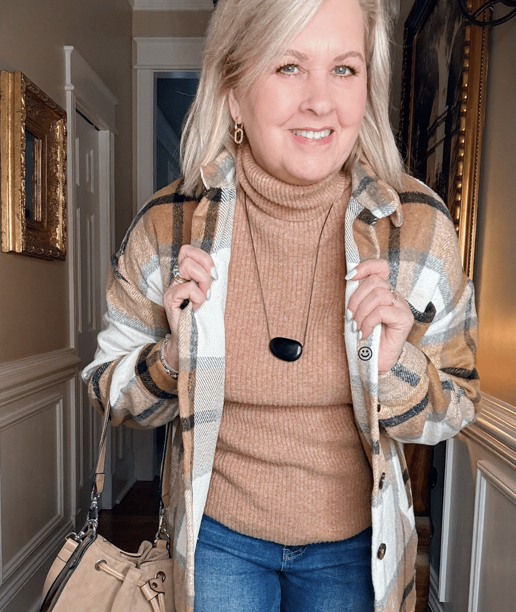 Tania wearing a plaid shacket with a black necklace