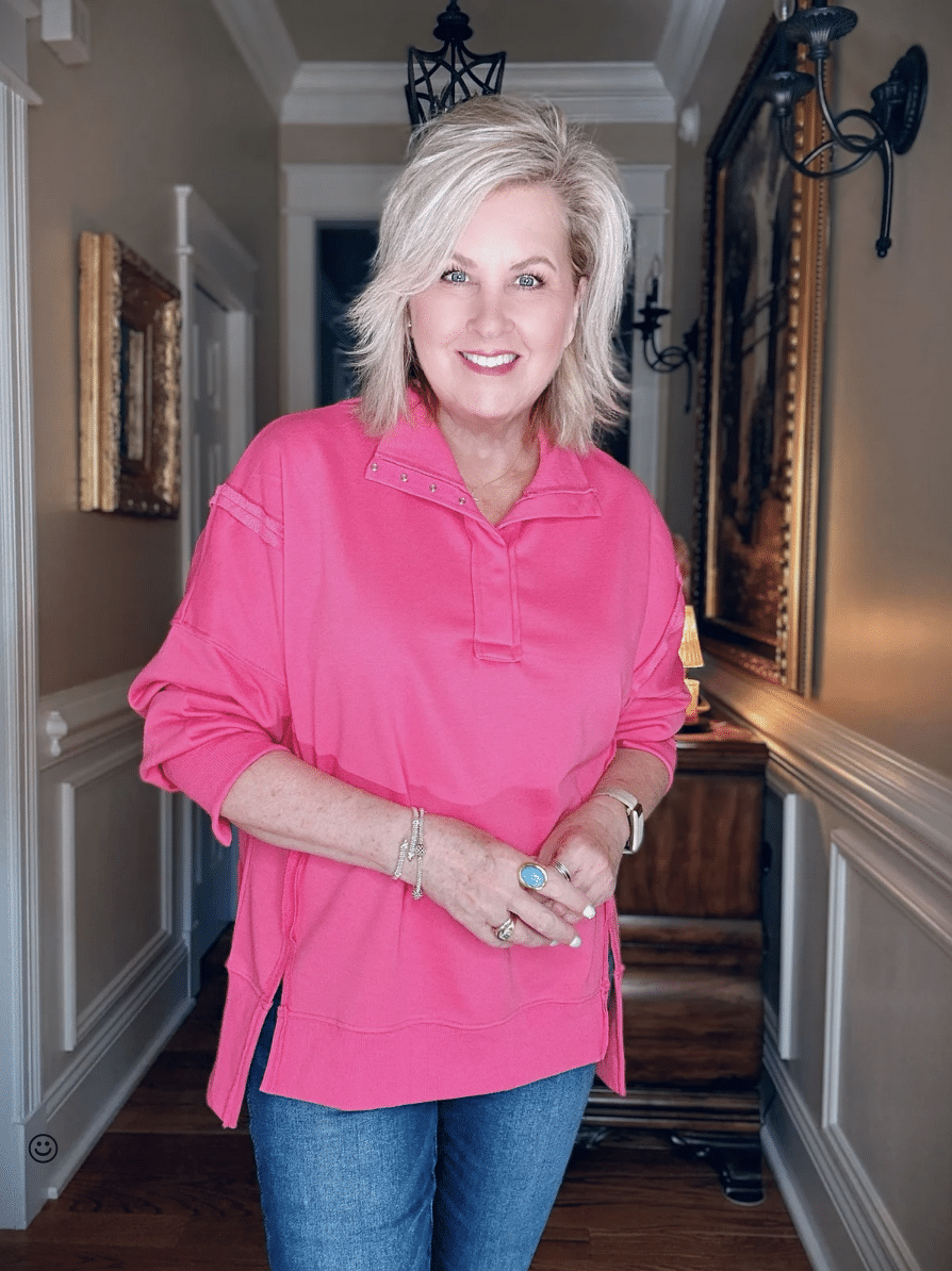 Tania wearing a bright pink oversized sweatshirt from Amazon