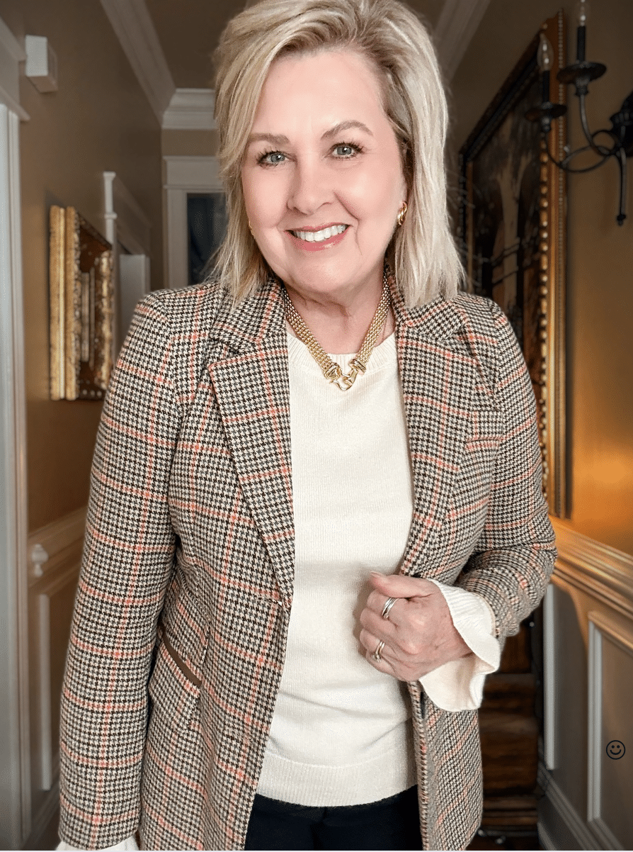 Tania wearing black pants with a plaid blazer from Amazon