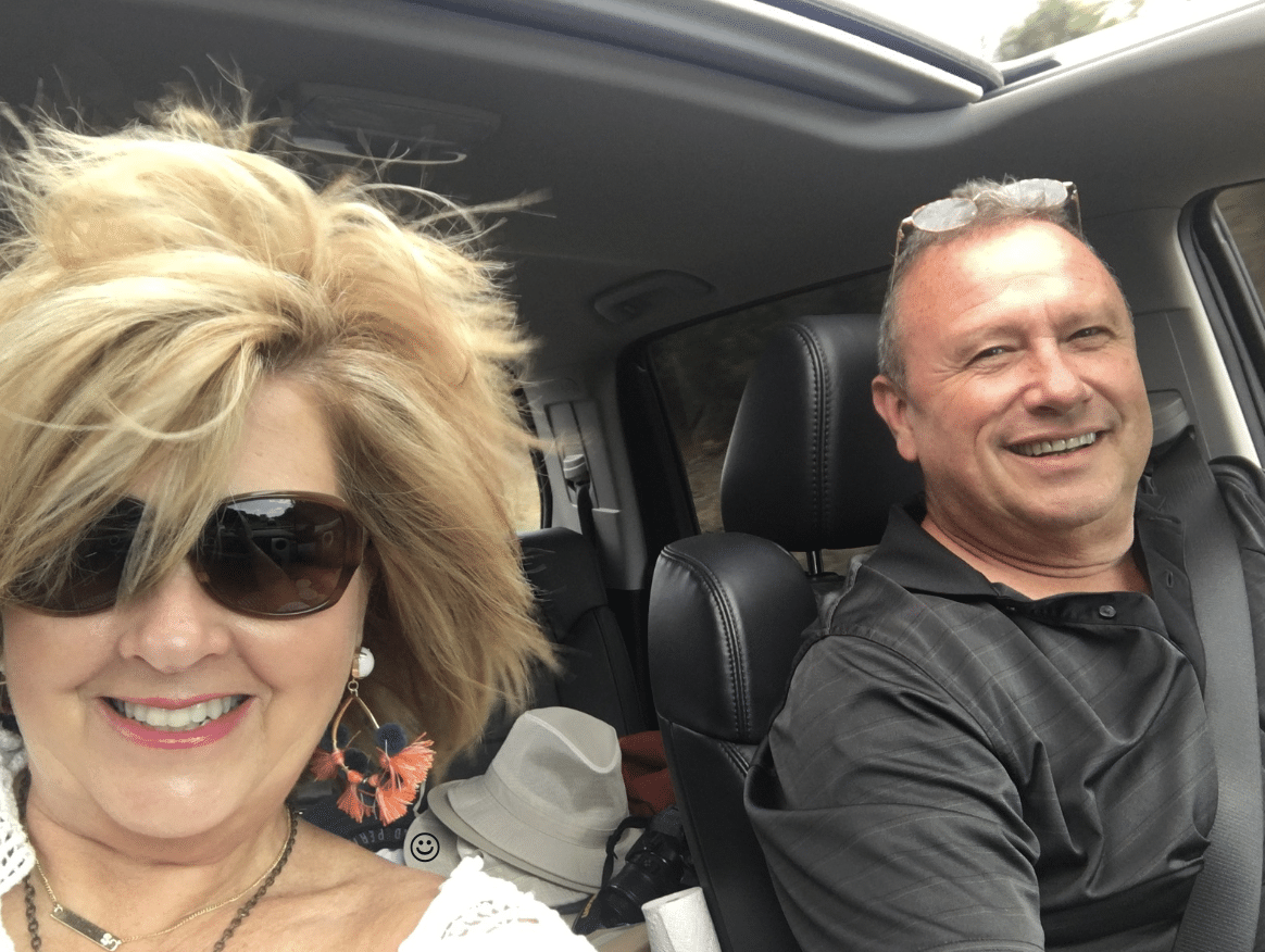 Tania with hair flying as she and Joe drive to Florida with the sunroof open