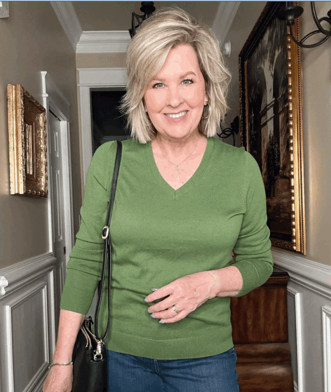 Tania wearing a green v-neck sweater from Amazon