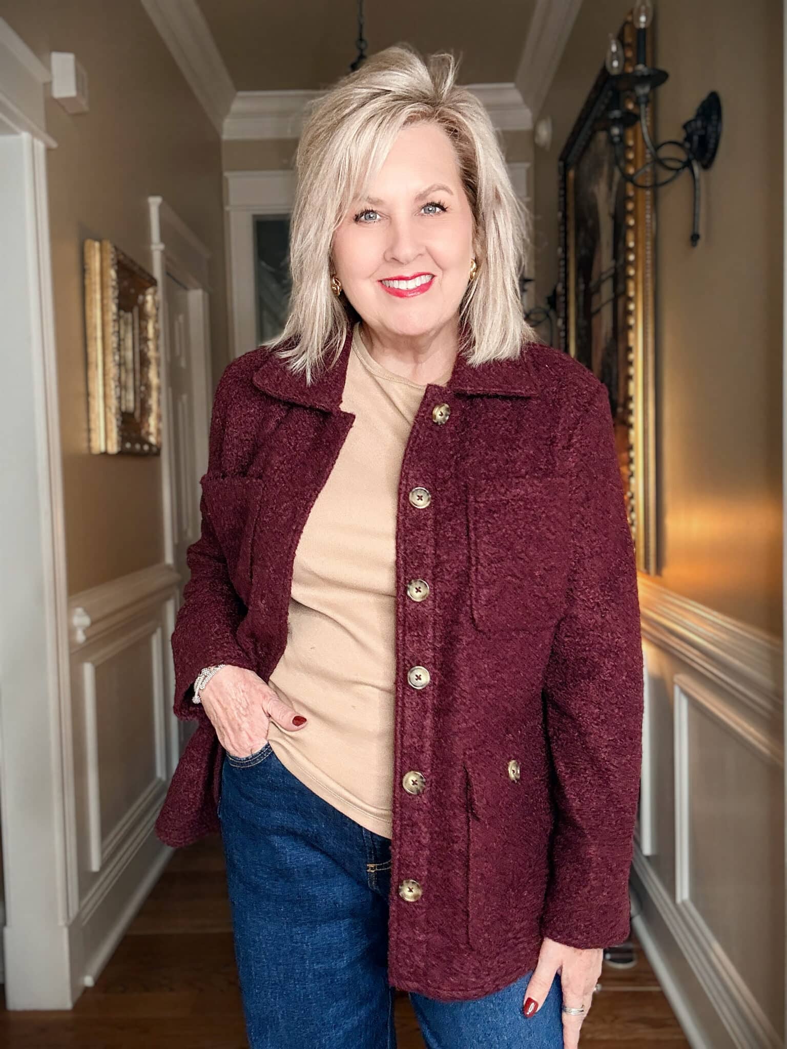 Tania wearing a camel ribbed tee with a burgundy boucle coat from Walmart