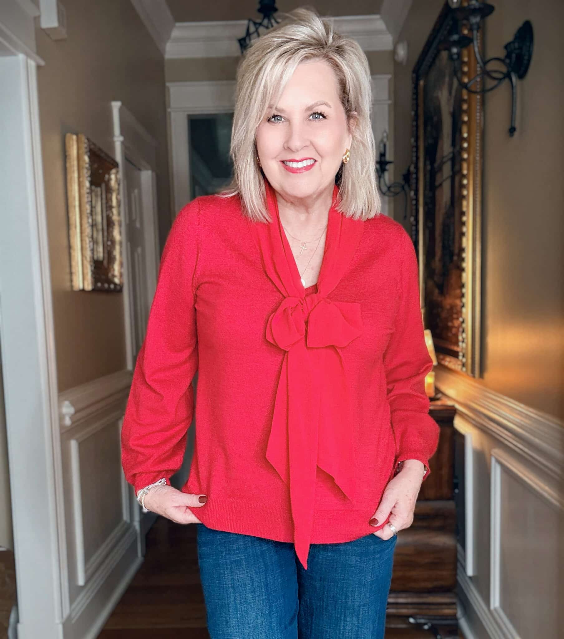 Tania in a red bow sweater from Chico's